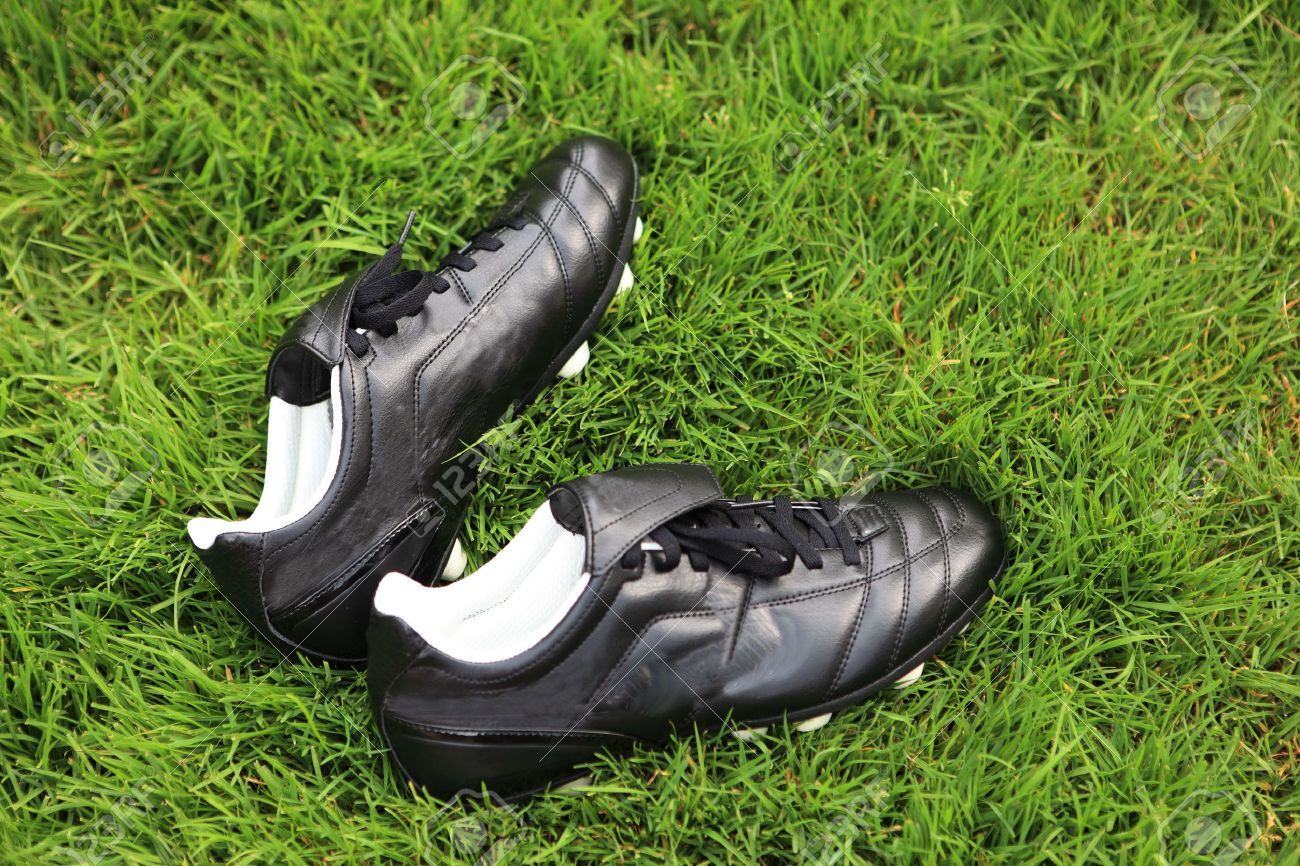 5317920 pair of soccer shoes on grass field