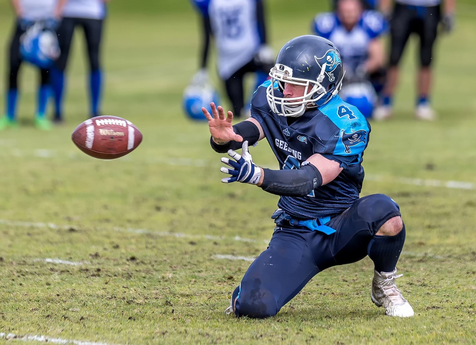 American football is played mainly by hand